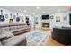 Spacious living room with stone fireplace, hardwood floors, and decorative guitars adorning the wall at 11 York Trce, Cartersville, GA 30121