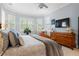 Tranquil main bedroom with bay windows, a TV, and detailed wooden furniture at 11 York Trce, Cartersville, GA 30121