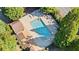 Aerial view of the community pool with lounge chairs surrounded by mature trees at 11 York Trce, Cartersville, GA 30121
