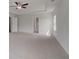 Large bedroom with carpet, a ceiling fan and tray ceiling at 165 Haverling Pass, Hampton, GA 30228