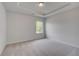 Bedroom with large window, recessed lighting, and neutral carpet at 165 Haverling Pass, Hampton, GA 30228