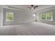 Spacious bedroom with neutral carpet, recessed lights, and multiple windows at 165 Haverling Pass, Hampton, GA 30228