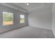 Cozy bedroom featuring neutral walls, plush carpet and plenty of light at 165 Haverling Pass, Hampton, GA 30228