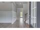 Inviting foyer with hardwood flooring, decorative molding, and a view of the staircase at 165 Haverling Pass, Hampton, GA 30228