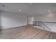 Hallway with attractive wood floors, metal railing and recessed ceiling lights at 165 Haverling Pass, Hampton, GA 30228