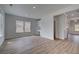 Inviting living room with hardwood flooring, ample natural light, and a built-in desk at 165 Haverling Pass, Hampton, GA 30228
