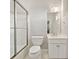 Clean bathroom with white tile and glass enclosed shower at 2362 Saint Davids Nw Sq # 4, Kennesaw, GA 30152