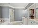 Marble bathroom boasts a soaking tub, walk-in shower, and double vanity sinks with a separate walk-in closet at 2362 Saint Davids Nw Sq # 4, Kennesaw, GA 30152