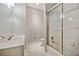 Bright bathroom features a white vanity sink, toilet, and enclosed shower-tub combination at 2362 Saint Davids Nw Sq # 4, Kennesaw, GA 30152
