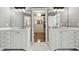 Bright bathroom features double vanity sinks with marble countertops and a walk-in closet with custom shelving at 2362 Saint Davids Nw Sq # 4, Kennesaw, GA 30152