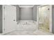 Bathroom featuring marble tile, soaking tub, and glass shower at 2362 Saint Davids Nw Sq # 4, Kennesaw, GA 30152