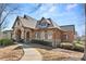 Stone and brick exterior home with arched windows and beautifully landscaped yard at 2362 Saint Davids Nw Sq # 4, Kennesaw, GA 30152