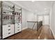 Upstairs hallway with hardwood flooring and white built-in shelves with drawers at 2362 Saint Davids Nw Sq # 4, Kennesaw, GA 30152