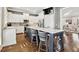 Bright kitchen with stainless appliances, center island, and hardwood floors at 2362 Saint Davids Nw Sq # 4, Kennesaw, GA 30152