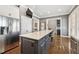 Spacious kitchen featuring a center island, stainless steel fridge, and open layout at 2362 Saint Davids Nw Sq # 4, Kennesaw, GA 30152