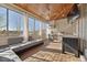 Screened in porch features an outdoor kitchen and multiple seating areas with a vaulted wood plank ceiling at 2362 Saint Davids Nw Sq # 4, Kennesaw, GA 30152