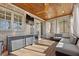 Screened in porch features an outdoor kitchen with a mini fridge and seating at 2362 Saint Davids Nw Sq # 4, Kennesaw, GA 30152
