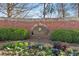 Beautiful Overlook at Marietta Country Club community sign nestled in a brick wall with lush landscaping at 2362 Saint Davids Nw Sq # 4, Kennesaw, GA 30152