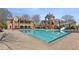 Community pool area with waterslide and lounging chairs in beautiful architectural surroundings at 2362 Saint Davids Nw Sq # 4, Kennesaw, GA 30152