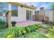 A backyard with a brick patio, lush landscaping, and a privacy fence at 315 Towergate Pl, Atlanta, GA 30350