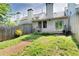 Fenced backyard with a small deck, grassy area and landscaping provides a private outdoor space at 315 Towergate Pl, Atlanta, GA 30350