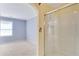 Bathroom featuring a glass door shower, neutral walls, and bright windows for natural lighting at 315 Towergate Pl, Atlanta, GA 30350
