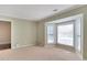 Bedroom featuring neutral paint, carpet, bay windows and a large built in book case at 315 Towergate Pl, Atlanta, GA 30350