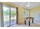 Bright bedroom featuring sliding glass doors to the yard, neutral carpeting, and a ceiling fan at 315 Towergate Pl, Atlanta, GA 30350