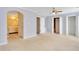 Spacious bedroom featuring an open bathroom, closets, and neutral colored walls and carpeting at 315 Towergate Pl, Atlanta, GA 30350
