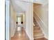 Hallway with hardwood floors and carpeted stairs at 315 Towergate Pl, Atlanta, GA 30350