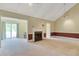 Bright living area with a fireplace, tall ceilings, and sliding doors to a backyard at 315 Towergate Pl, Atlanta, GA 30350
