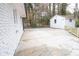 A large cement patio features a backyard with a utility shed at 3893 Bonnie Se Ln, Atlanta, GA 30354