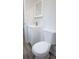 A half bathroom features a single vanity, a mirror, and a commode at 3893 Bonnie Se Ln, Atlanta, GA 30354