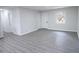 Large living room with gray flooring and fresh paint and base trim at 3893 Bonnie Se Ln, Atlanta, GA 30354