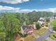 Aerial view of a suburban home with well-manicured lawn at 2118 Township Dr, Woodstock, GA 30189