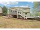 Exterior view of the home with deck and screened in porch at 2118 Township Dr, Woodstock, GA 30189
