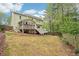 Exterior view of the home with a spacious backyard at 2118 Township Dr, Woodstock, GA 30189