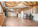 Unfinished basement with wood-look floors and exposed ceiling at 2118 Township Dr, Woodstock, GA 30189