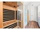 Modern bathroom featuring a sauna, glass shower, and wood-look floors at 2118 Township Dr, Woodstock, GA 30189