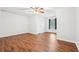 Large bedroom with wood-look floors, ceiling fan, and a window at 2118 Township Dr, Woodstock, GA 30189