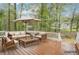 Outdoor deck featuring comfortable patio furniture and umbrella at 2118 Township Dr, Woodstock, GA 30189