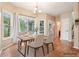 Open dining area featuring hardwood floors, natural light from the window, and classic decor at 2118 Township Dr, Woodstock, GA 30189