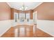Cozy dining room features hardwood floors, dark walls, a chandelier, and bright bay windows at 2118 Township Dr, Woodstock, GA 30189
