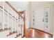 Inviting foyer with hardwood floors, stairs and a view into other rooms at 2118 Township Dr, Woodstock, GA 30189
