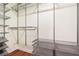 Spacious walk-in closet with metal shelves and drawers for organized storage at 2118 Township Dr, Woodstock, GA 30189