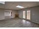 Finished basement with wood-look flooring, a decorative fireplace, and plenty of space at 2234 Oak Falls Ln, Buford, GA 30519