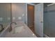 Bathroom featuring single vanity with white countertop, modern fixtures, and a tiled shower at 2234 Oak Falls Ln, Buford, GA 30519