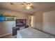 Well-lit bedroom featuring built-in shelving, TV, and closet for storage and entertainment at 2234 Oak Falls Ln, Buford, GA 30519