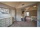 Bedroom with carpeted floors, light paint, trim, a desk and a dresser along one wall at 2234 Oak Falls Ln, Buford, GA 30519