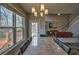 Dining area featuring table with seating for six, open to living room, and access to outdoor deck at 2234 Oak Falls Ln, Buford, GA 30519